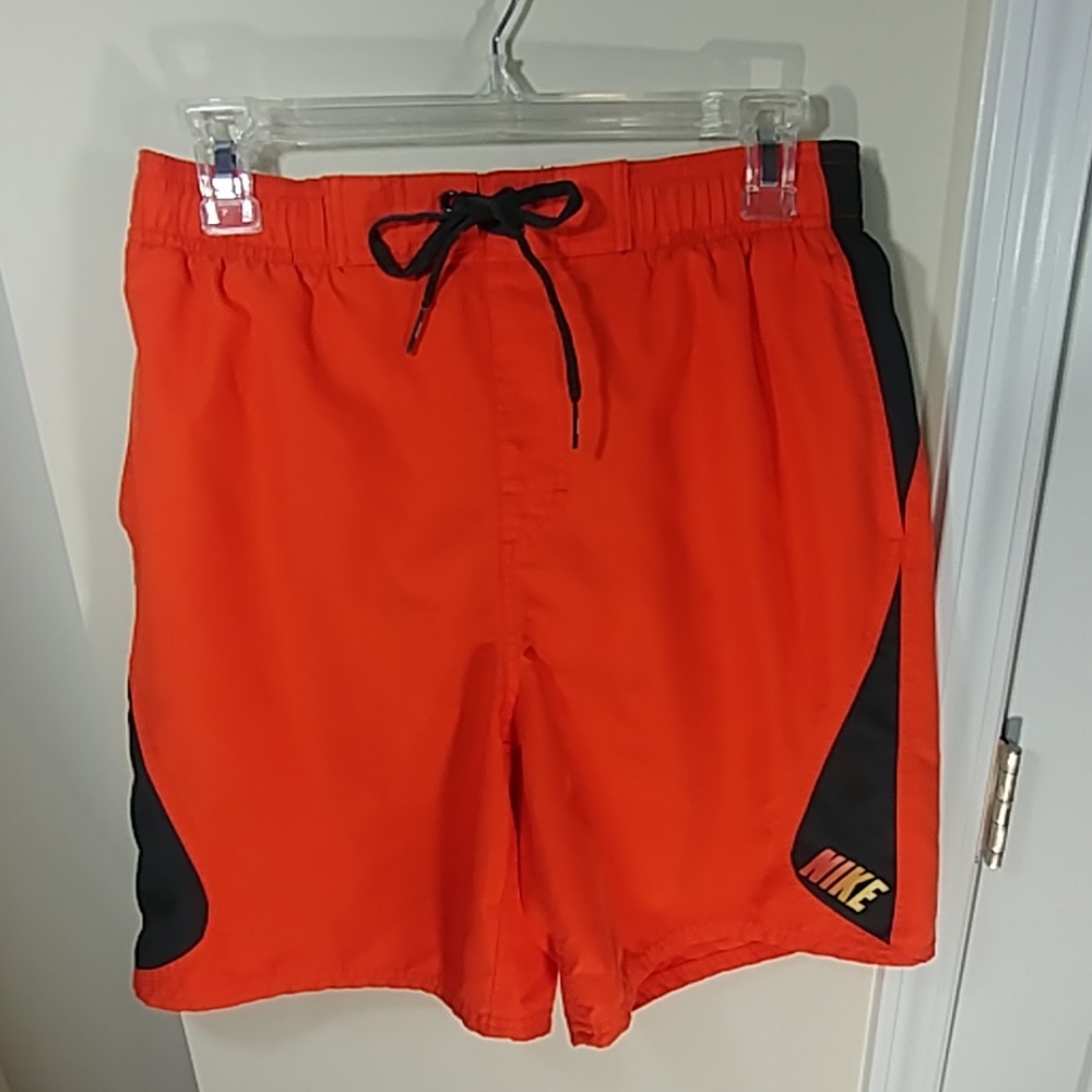 Orange Nike swim trunks